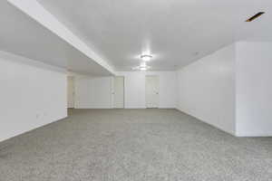 Finished basement with carpet flooring and baseboards