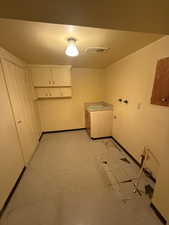 Washroom featuring baseboards and a sink