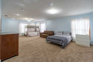 Carpeted bedroom featuring recessed lighting