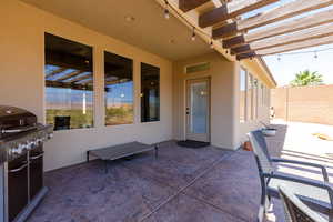 View of patio / terrace featuring a grill and a pergola