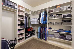 Walk in closet featuring carpet floors