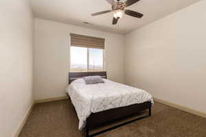 Bedroom featuring carpet flooring and ceiling fan