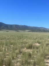 View of mountain background featuring rural landscape