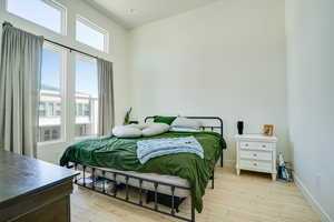 Bedroom with light wood-style floors
