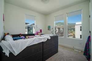 Living room with carpet flooring and baseboards