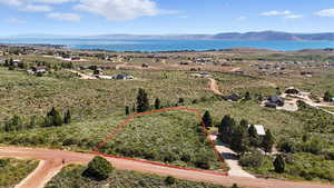 View of property location featuring a water and mountain view and property boundaries highlighted