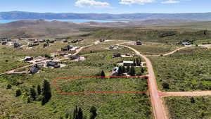 View of property location with a mountainous background and property boundaries highlighted