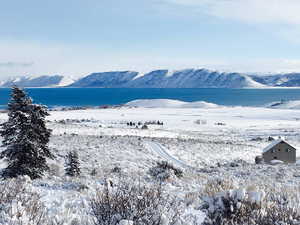 View of mountain backdrop featuring a large body of water