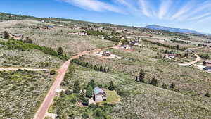 Aerial view of sparsely populated area with a mountain backdrop