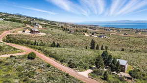 View from above of property featuring a water and mountain view