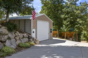Detached garage featuring driveway