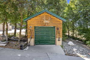 Detached garage featuring driveway