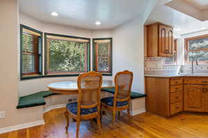 Dining room featuring light wood finished floors and recessed lighting