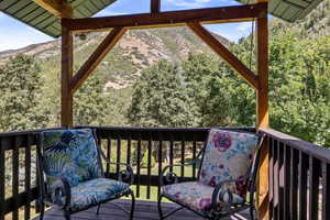 Wooden deck featuring a mountain view