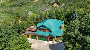 View of subject property featuring a heavily wooded area