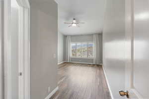 Spare room featuring ceiling fan and wood finished floors