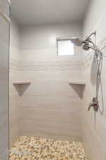 Full bath with tiled shower