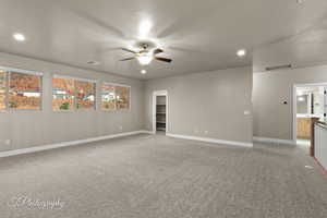 Unfurnished room featuring ceiling fan, light carpet, and recessed lighting