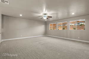Unfurnished room with ceiling fan, recessed lighting, carpet floors, and a textured ceiling