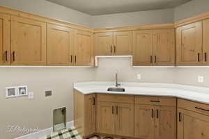 Laundry room with cabinet space, washer hookup, and hookup for an electric dryer
