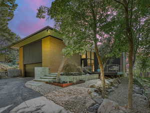 View of front facade with driveway and an attached garage