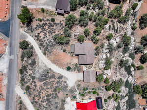 Aerial view of property and surrounding area featuring a desert landscape