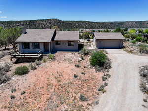 Single story home with driveway and a tiled roof