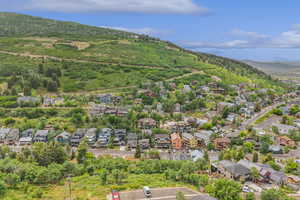 Aerial view of residential area featuring mountains