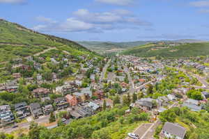 Aerial view of residential area featuring a mountain backdrop