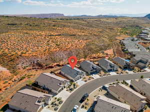 Aerial view of residential area with a mountainous background