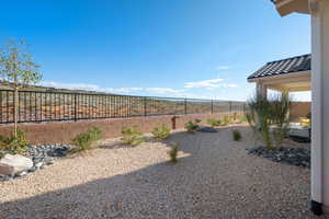 View of fenced backyard