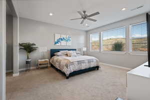 Bedroom with light carpet, recessed lighting, and ceiling fan