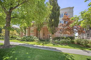 View of front facade with brick siding and a front yard