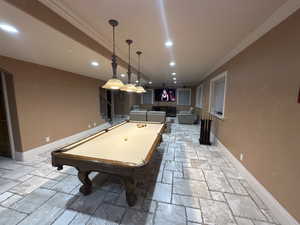 Game room with crown molding, stone tile flooring, billiards table, and recessed lighting