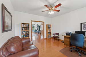 Office space featuring light wood-type flooring and a ceiling fan