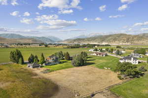 View of mountain backdrop with rural landscape