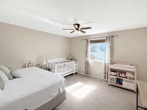 Bedroom featuring carpet and a ceiling fan