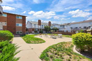 View of community with a residential view and a patio area