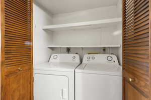 Laundry room featuring independent washer and dryer