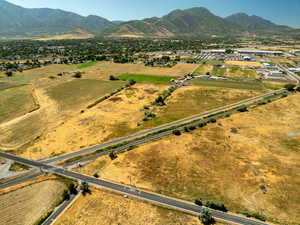 Aerial view of property's location with a mountainous background and rural landscape