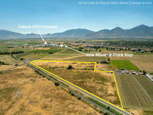 Overview of rural landscape featuring property parcel outlined and mountains