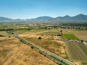 Overview of rural landscape featuring a mountain backdrop