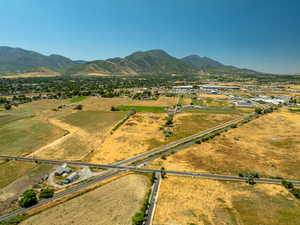 Aerial view of property and surrounding area with rural landscape and mountains