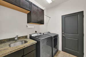 Laundry area with washing machine and dryer and cabinet space