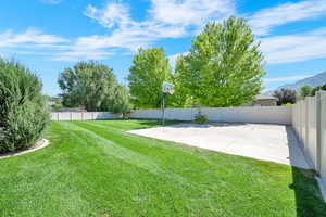 Fenced backyard featuring a mountain view