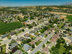View of property location with mountains and nearby suburban area