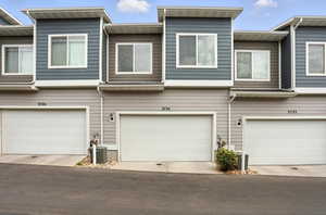 Townhome property featuring a 2 car garage