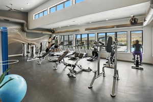 Gym with recessed lighting and large windows