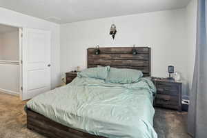 Primary Bedroom with carpet flooring and baseboards
