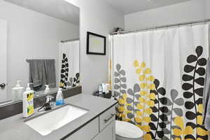 Bathroom with vanity and a shower with curtain